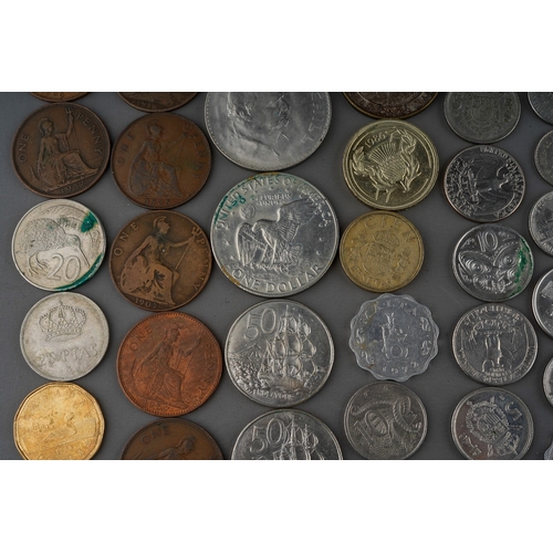 306 - A small collection of British and Foreign coins including two Churchill commemorative crowns, a 1972... 