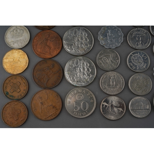 306 - A small collection of British and Foreign coins including two Churchill commemorative crowns, a 1972... 