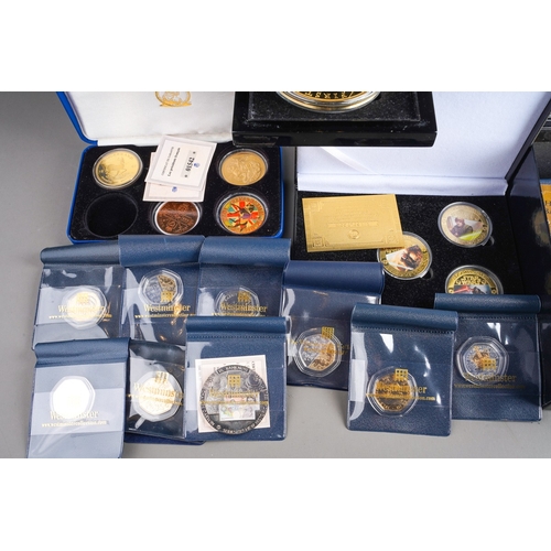 323 - A box of modern commemorative coins, empty coin boxes and packs