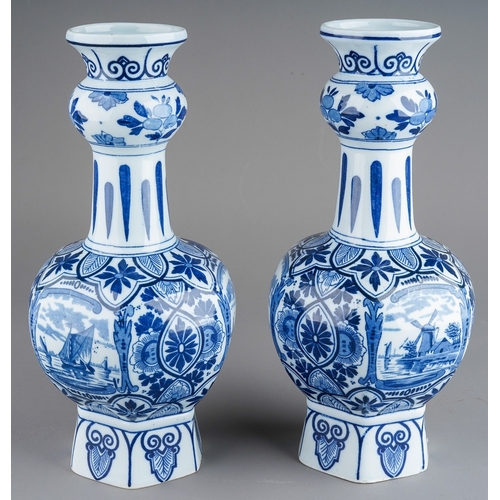 358 - A pair of 20th century Delft vases, printed in traditional blue with scenes of boats, on a deep hexa... 