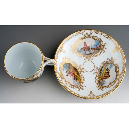 380 - An 18th Century style Meissen cup and saucer, the cup with twist handles painted with two vignettes ... 