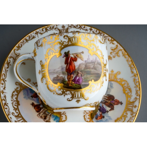 381 - An 18th Century style Meissen cup and saucer, the cup with twist handles painted with two vignettes ... 