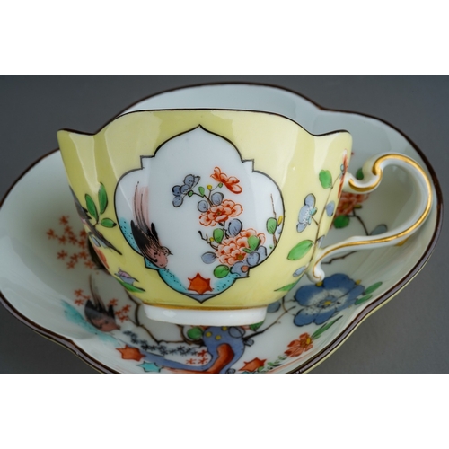 382 - An early 20th Century Meissen Chinoiserie quatrefoil shaped cup and saucer, yellow ground decorated ... 