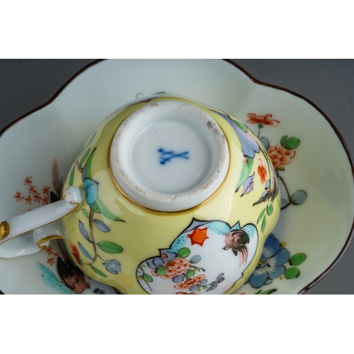 382 - An early 20th Century Meissen Chinoiserie quatrefoil shaped cup and saucer, yellow ground decorated ... 