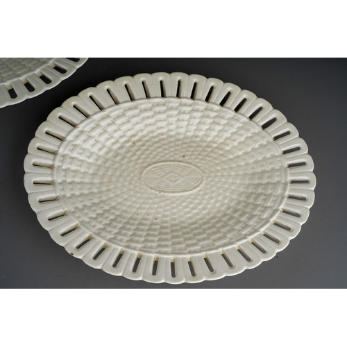 388 - A pair of Georgian style creamware oval basketweave plates with pierced borders, stamped to undersid... 