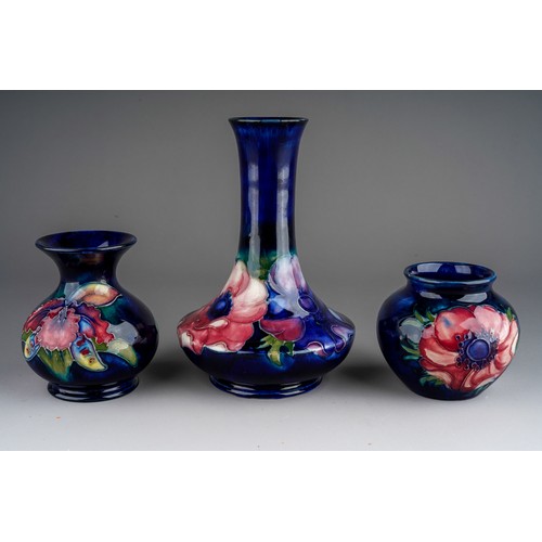 392 - Seven pieces of Moorcroft to include a Leaf and berry jug together with three various vases (anemone... 