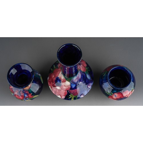 392 - Seven pieces of Moorcroft to include a Leaf and berry jug together with three various vases (anemone... 