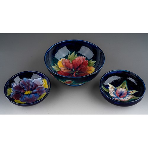 392 - Seven pieces of Moorcroft to include a Leaf and berry jug together with three various vases (anemone... 