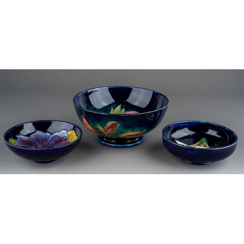 392 - Seven pieces of Moorcroft to include a Leaf and berry jug together with three various vases (anemone... 