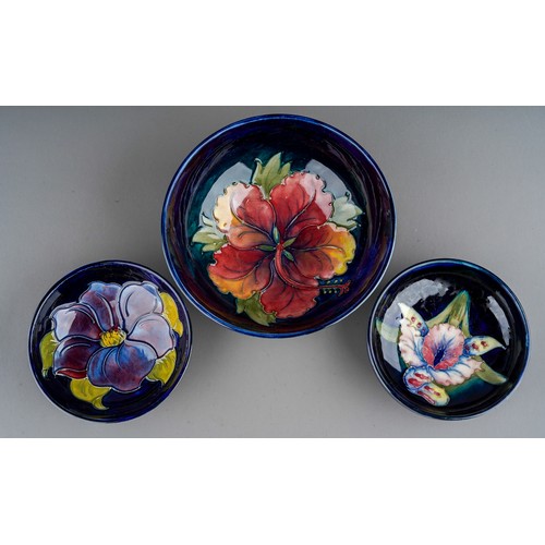 392 - Seven pieces of Moorcroft to include a Leaf and berry jug together with three various vases (anemone... 