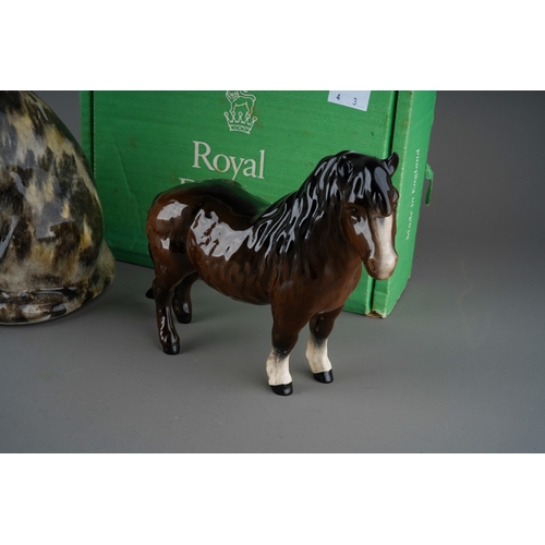 396 - Large Winstanley tabby cat with glass eyes, signed to underside, a Beswick two tone Brown gelding, s... 