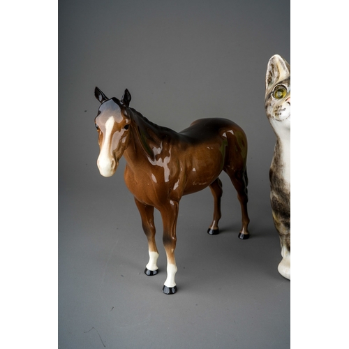 396 - Large Winstanley tabby cat with glass eyes, signed to underside, a Beswick two tone Brown gelding, s... 