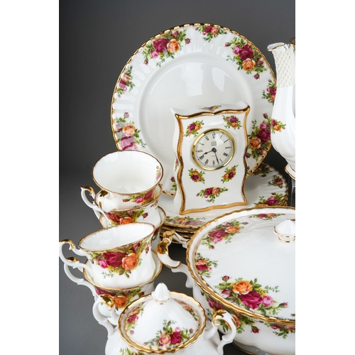 398 - Large collection of  Royal Albert Country Roses pattern tea and dinner wares to include coffee pot, ... 