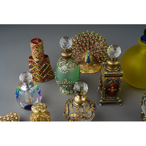 437 - A collection of  enameled filigree glass scent bottles, ornaments and enameled trinket pots. 
To inc... 