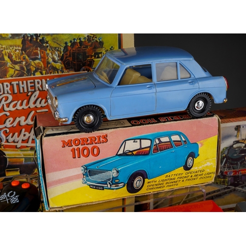 459 - A collection of boxed and loose toy cars, etc and railway related books, postcards, etc, including a... 