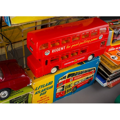 459 - A collection of boxed and loose toy cars, etc and railway related books, postcards, etc, including a... 