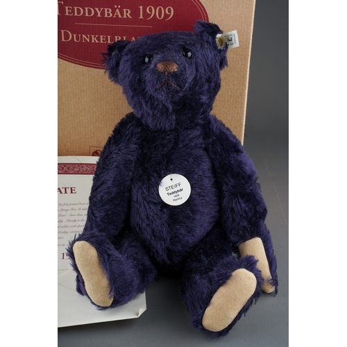 463 - A Steiff Replica 1909 Teddy Bear, dark blue growler, button and white label to ear, limited edition ... 