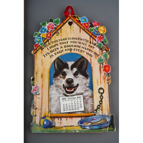 483 - A vintage American Dog themed calendar for 1930, complete, each month with dog's head inside kennel ... 