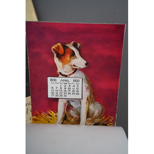 483 - A vintage American Dog themed calendar for 1930, complete, each month with dog's head inside kennel ... 