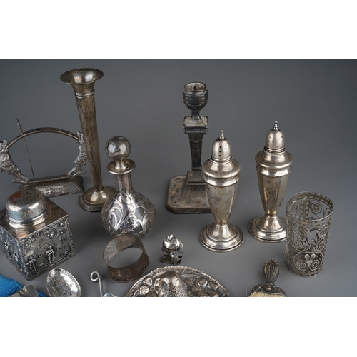 498 - An Edwardian silver Neo-Classical candlestick, hallmarked London, 1902, filled and tarnished togethe... 