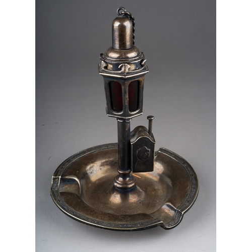 499 - An early 20th Century American white metal combination ashtray, cutter and lighter in the form of a ... 