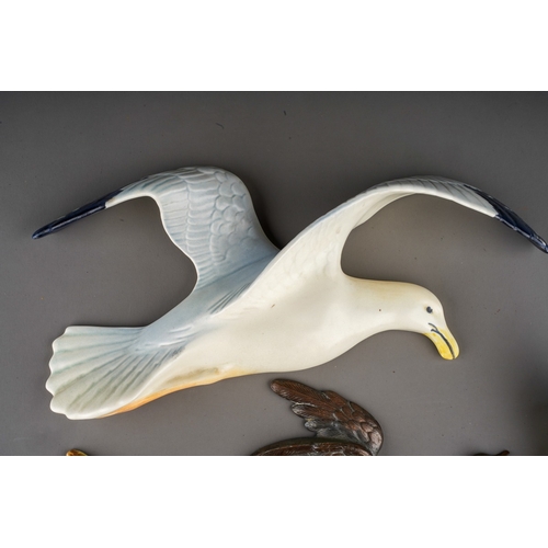 501 - A Beswick Seagull wall plaque, 658/1 together with Burslem Duck and a Royal Dux 10777 flying Duck an... 