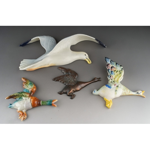 501 - A Beswick Seagull wall plaque, 658/1 together with Burslem Duck and a Royal Dux 10777 flying Duck an... 