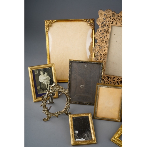 506 - Assorted early 20th Century gilt metal photograph frames, various sizes and designs (1 box)