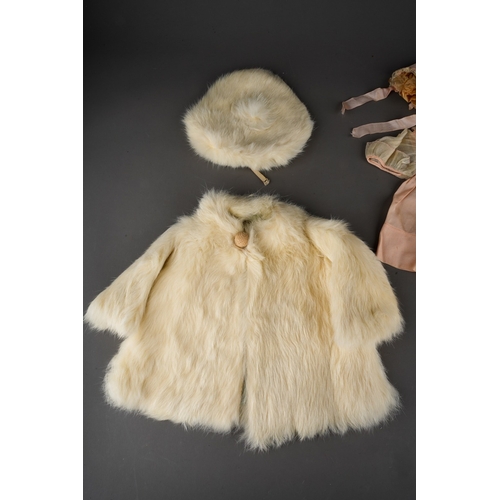 510 - Vintage doll's clothes to include: a white rabbit fur swing matinee coat with matching beret; a Macy... 