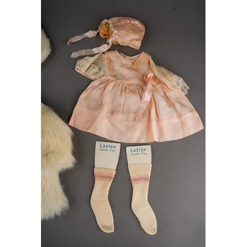 510 - Vintage doll's clothes to include: a white rabbit fur swing matinee coat with matching beret; a Macy... 