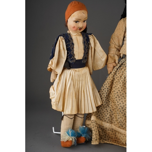 514 - An American Folk Art cloth Native Indian doll with painted face, she wear plaits, a blouse, skirt an... 