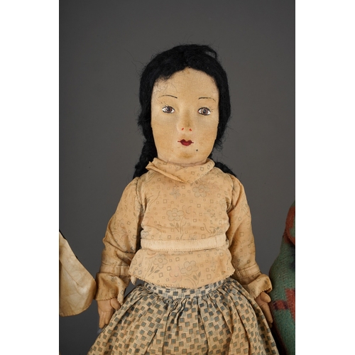 514 - An American Folk Art cloth Native Indian doll with painted face, she wear plaits, a blouse, skirt an... 