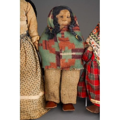 514 - An American Folk Art cloth Native Indian doll with painted face, she wear plaits, a blouse, skirt an... 