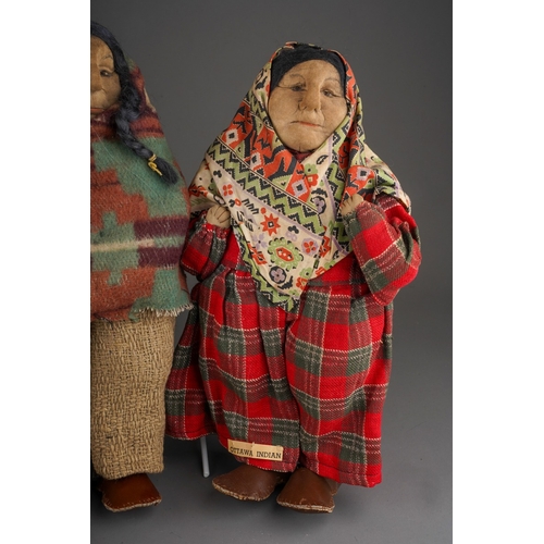 514 - An American Folk Art cloth Native Indian doll with painted face, she wear plaits, a blouse, skirt an... 