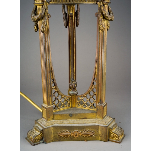 519 - An early 20th Century gilt metal mounted Empire style lamp on tripod support with caryatid supports,... 