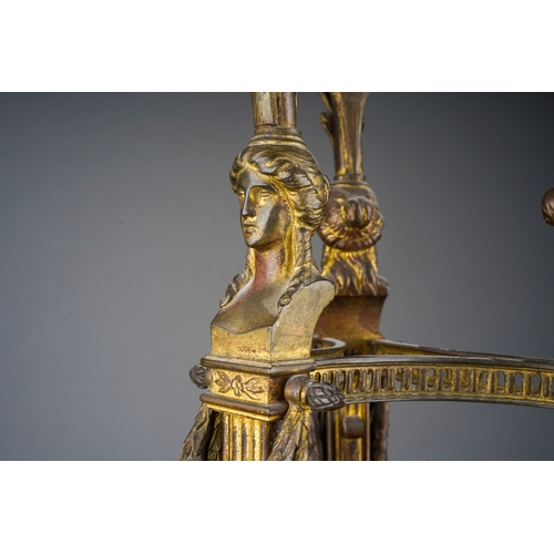 519 - An early 20th Century gilt metal mounted Empire style lamp on tripod support with caryatid supports,... 