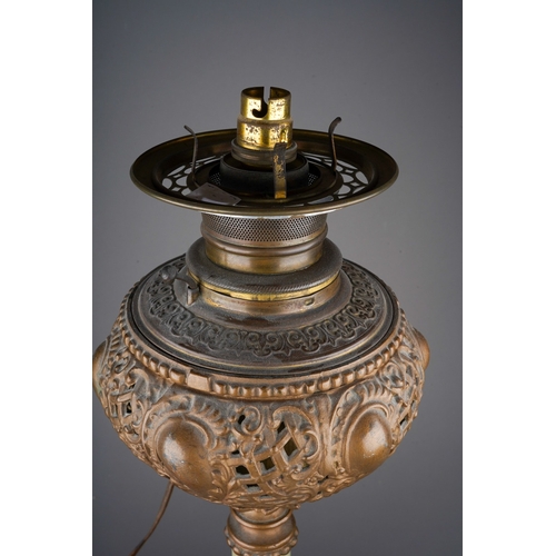 520 - Gilt metal and alabaster oil lamp base converted to electricity,  a large American pink glass shade ... 