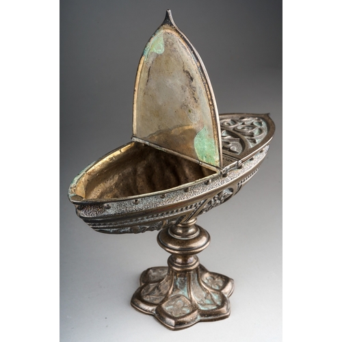 537 - A Continental cast silvered metal boat shaped bon bon dish on raised supports, with foliate decorati... 