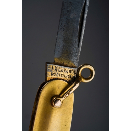 556 - A yellow metal ( marked 14k) mounted fruit knife, blade by George Wostenholm IXL  , the plain body i... 