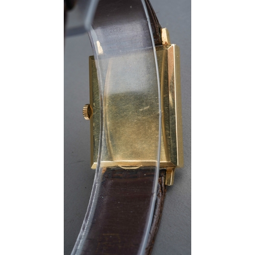 557 - A vintage Swiss Angelus 14K gold wrist watch, engine turned rectangular case with central oval dial ... 