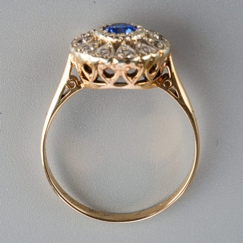 577 - A mid 20th century cluster ring. Set with a blue synthetic blue spinel, surrounded by colourless syn... 