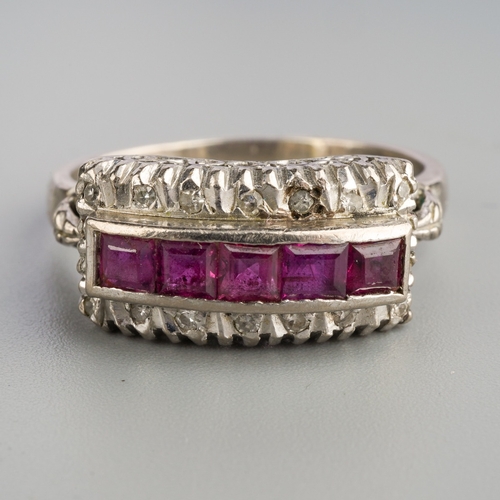 578 - A ruby and diamond dress ring. Set with a line of square shape rubies, surrounded by single cut diam... 