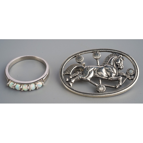 580 - Silver brooch of a leaping horse marked Sterling Denmark to back and silver ring set with opal style... 