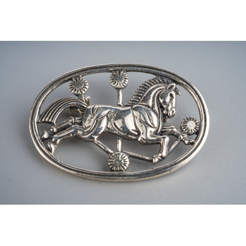 580 - Silver brooch of a leaping horse marked Sterling Denmark to back and silver ring set with opal style... 