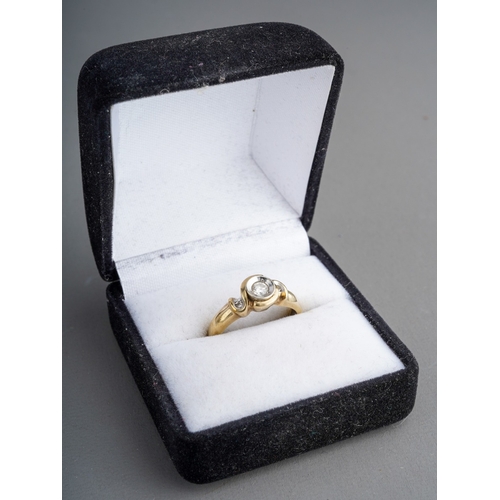 582 - A 9ct gold diamond three stone ring. Set with three graduating round brilliant cut diamond, estimate... 