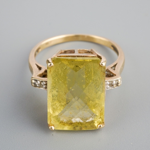 583 - A 9ct gold citrine and diamond dress ring. Set with a principal top faceted rectangular shape citrin... 