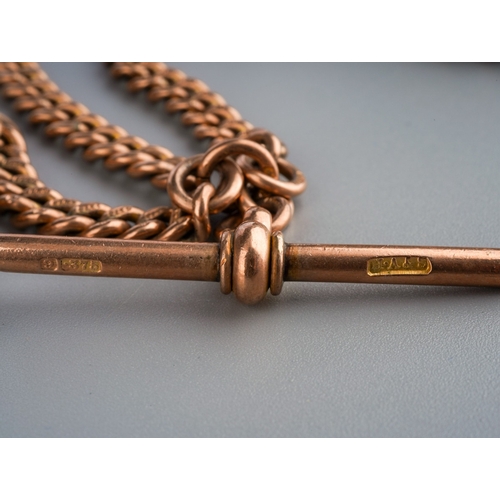 585 - An early 20th century 9ct gold Albert chain with swivel fob. The solid curb link chain with T bar an... 