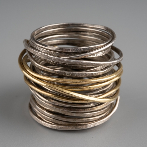 593 - Disa Alsopp Grand Spaghetti ring, 18k yellow gold and sterling silver wrapped wire, gross weight 15.... 