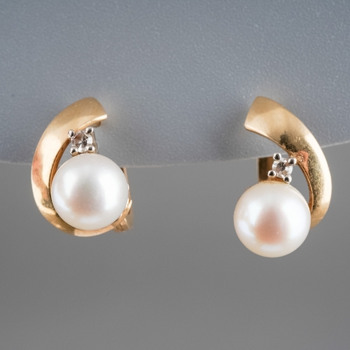 605 - A pair of 14 ct gold (marked 585) Pearl and diamond set earrings