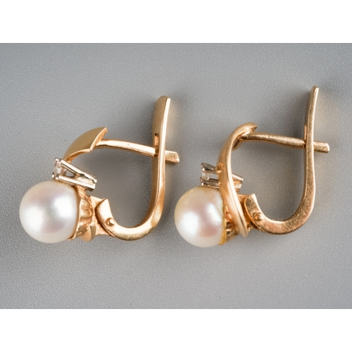 605 - A pair of 14 ct gold (marked 585) Pearl and diamond set earrings